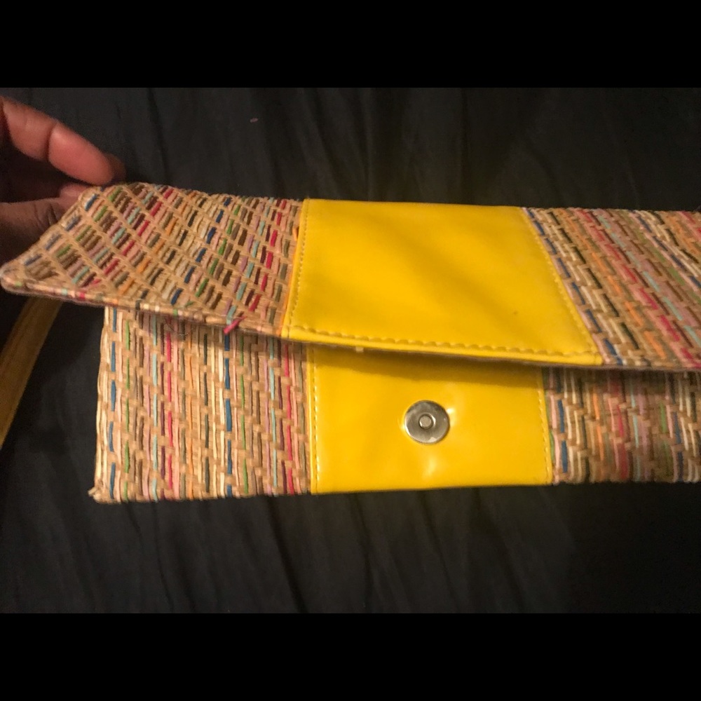 Yellow and striped straw clutch